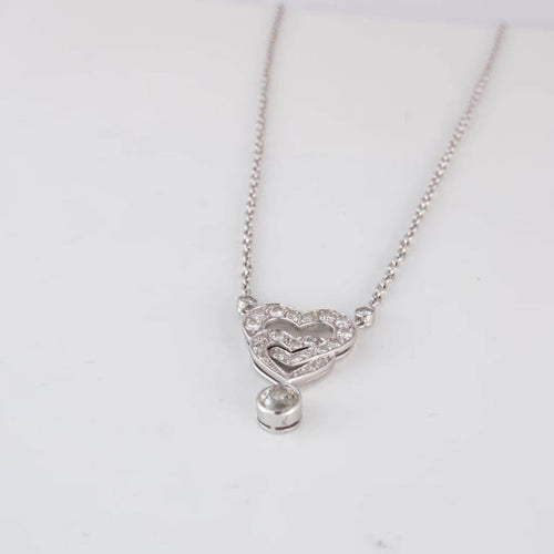 Collier Collier pendentif cœurs entrelacés en or blanc 18 ct et diamants 58 Facettes 1