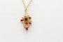 Pendentif Pendentif en or jaune 750 avec rubis et diamants 58 Facettes 250293