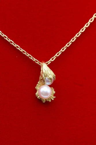 Pendentif Pendentif moderne en or jaune 750 et perles de culture 58 Facettes 240385