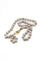 Collier Collier en or jaune et perles grises 58 Facettes 240134