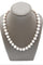 Collier Collier en or jaune et perles grises 58 Facettes 240134