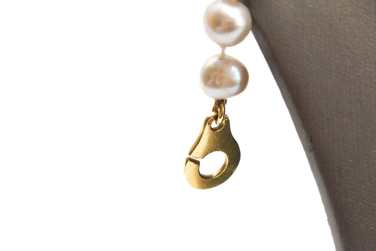 Collier Collier en or jaune et perles grises 58 Facettes 240134