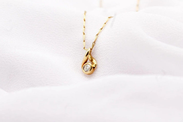 Pendentif Pendentif boucle en or jaune et diamant 58 Facettes 250437