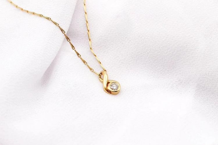 Pendentif Pendentif boucle en or jaune et diamant 58 Facettes 250437