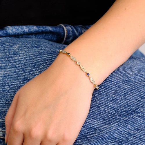 Bracelet Bracelet Art déco en or jaune et or blanc avec diamants et saphirs 58 Facettes
