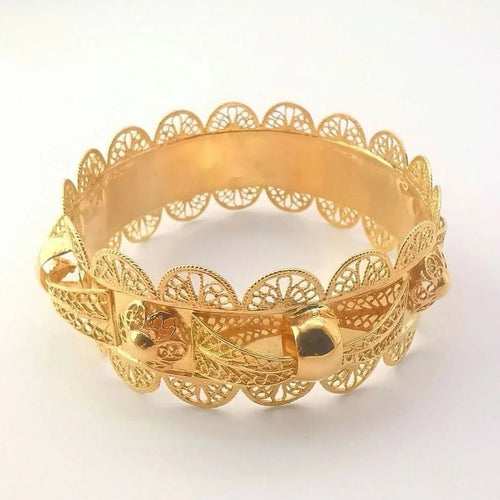 Bracelet Bracelet rigide oriental filigrané en or jaune 18 carats 58 Facettes