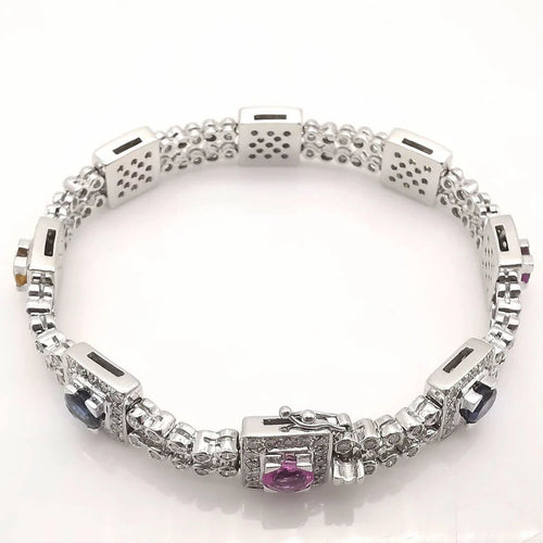 Bracelet Bracelet en or blanc 18 carats saphirs multicolores et diamants 58 Facettes Bracelet or blanc saphirs diamants certifié HRD Anvers