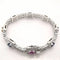 Bracelet Bracelet en or blanc 18 carats saphirs multicolores et diamants 58 Facettes Bracelet or blanc saphirs diamants certifié HRD Anvers