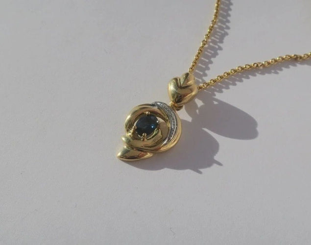 Pendentif Pendentif cœur bicolore en or 18 carats et saphir 58 Facettes