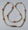 Collier Collier choker - Perles de culture Akoya et corail en or rose 18 carats 58 Facettes