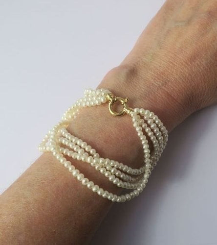 Bracelet Bracelet quatre rangs en or jaune et perles de culture 58 Facettes