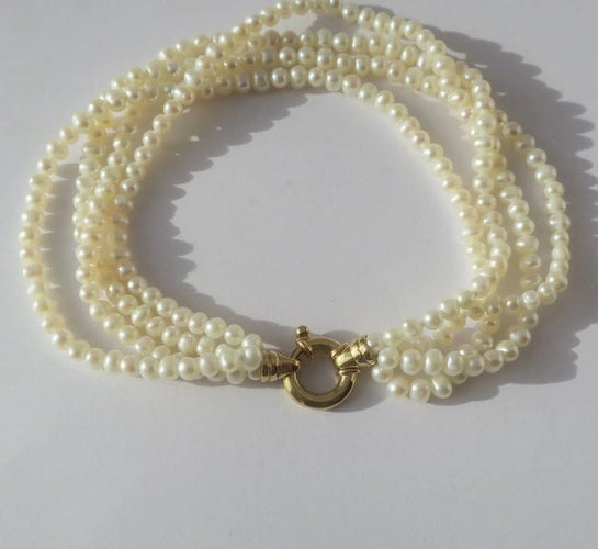 Bracelet Bracelet quatre rangs en or jaune et perles de culture 58 Facettes