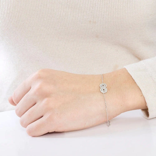 Bracelet Bracelet motif infini en or blanc 18K et diamants 58 Facettes