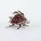 Broche Broche « Coccinelle » en or blanc avec rubis, tsavorites et diamants 58 Facettes