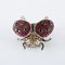 Broche Broche « Coccinelle » en or blanc avec rubis, tsavorites et diamants 58 Facettes