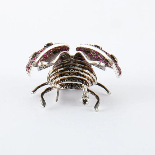 Broche Broche « Coccinelle » en or blanc avec rubis, tsavorites et diamants 58 Facettes
