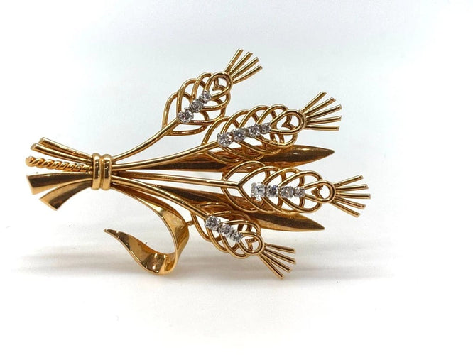 Broche Broche bouquet de fleurs en or jaune 18k et diamants 58 Facettes M8759
