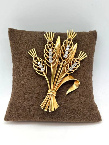 Broche Broche bouquet de fleurs en or jaune 18k et diamants 58 Facettes M8759