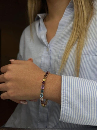 Bracelet Bracelet articulé en or jaune 18 carats et pierres multicolores 58 Facettes