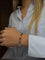 Bracelet Bracelet articulé en or jaune 18 carats et pierres multicolores 58 Facettes