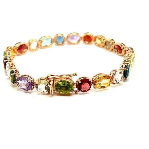 Bracelet Bracelet articulé en or jaune 18 carats et pierres multicolores 58 Facettes