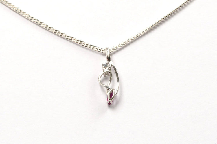 Pendentif Pendentif contemporain en or blanc, rubis et diamants 58 Facettes 21071