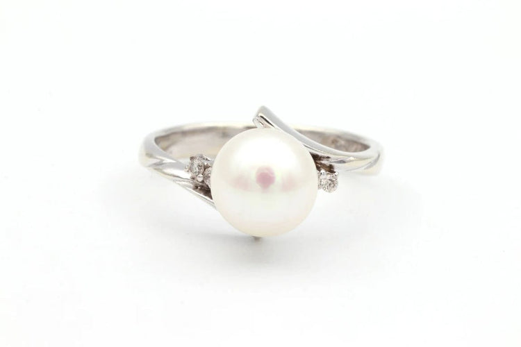 Bague 52 Bague années 70 en or blanc 18 carats avec perle et diamants 58 Facettes 19113