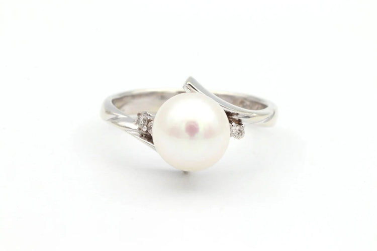 Bague 52 Bague années 70 en or blanc 18 carats avec perle et diamants 58 Facettes 19113