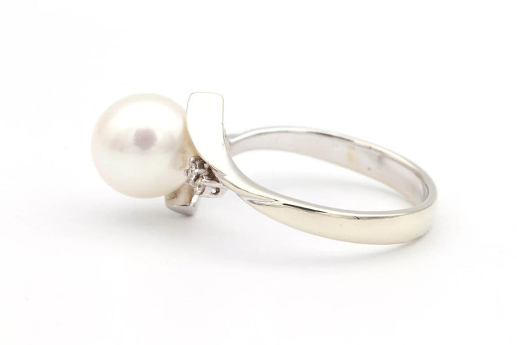 Bague 52 Bague années 70 en or blanc 18 carats avec perle et diamants 58 Facettes 19113