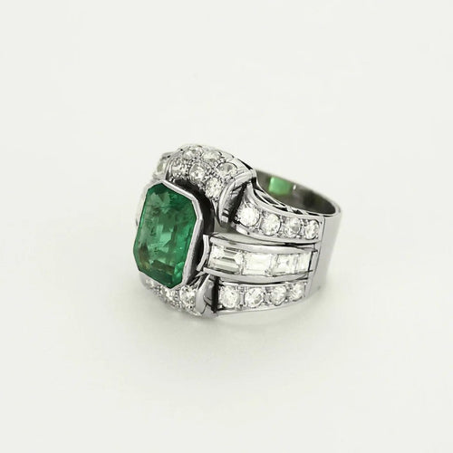 Bague 52 Bague Art déco en platine et or jaune, diamants et émeraude 58 Facettes