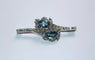 Broche Broche rétro en or gris 18 carats, aigues-marines et diamants 58 Facettes 580