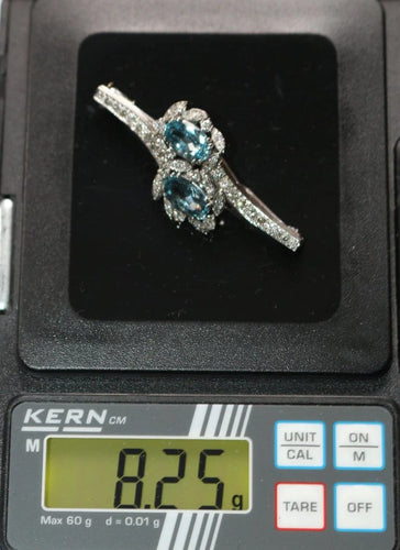 Broche Broche rétro en or gris 18 carats, aigues-marines et diamants 58 Facettes 580