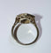 Bague 56 Bague Art déco hexagonale en or blanc et platine, diamants et saphirs 58 Facettes 156