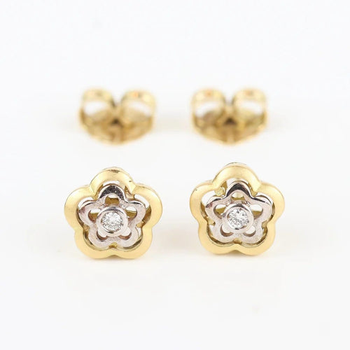 Boucles d'oreilles Boucles d'oreilles fleur en or jaune et blanc 18 carats et diamants 58 Facettes 131208