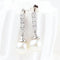 Boucles d'oreilles Boucles d'oreilles en or blanc 18 carats, diamants et perles 58 Facettes