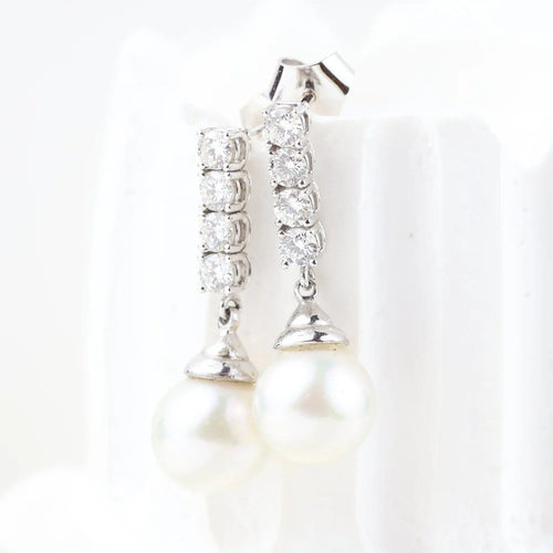Boucles d'oreilles Boucles d'oreilles en or blanc 18 carats, diamants et perles 58 Facettes