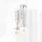 Boucles d'oreilles Boucles d'oreilles en or blanc 18 carats, diamants et perles 58 Facettes