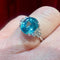 Bague 53 Bague en or blanc 18 carats avec zircon bleu et diamants 58 Facettes 7850 A