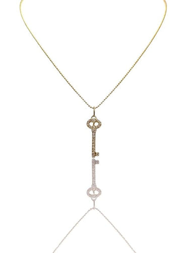 Collier Tiffany & Co - Collier porte-clés en or jaune 18 carats et diamants 58 Facettes 85572