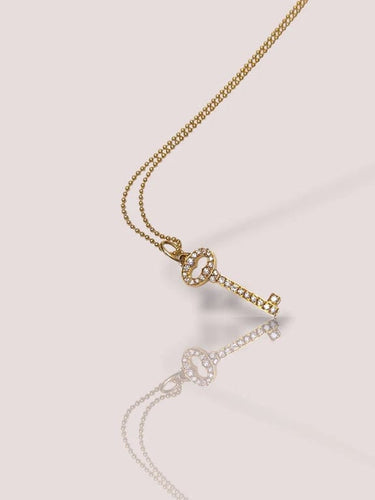 Collier Tiffany & Co - Collier porte-clés en or jaune 18 carats et diamants 58 Facettes 85572