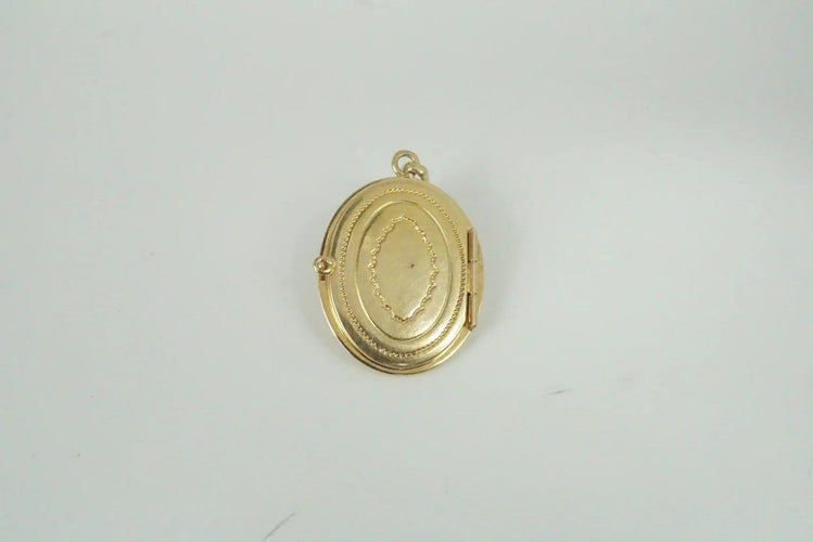 Pendentif Pendentif ovale en or jaune 18 carats, saphirs et perle 58 Facettes SQ5946394