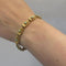Bracelet Bracelet en or jaune mat et turquoises 58 Facettes