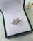 Bague 50 Bague fleur vintage en or gris 18 carats 58 Facettes 282