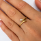 https://cdn.shopify.com/s/files/1/0943/8576/6747/files/bague-serpent-or-jaune-portee.png?v=1792769652