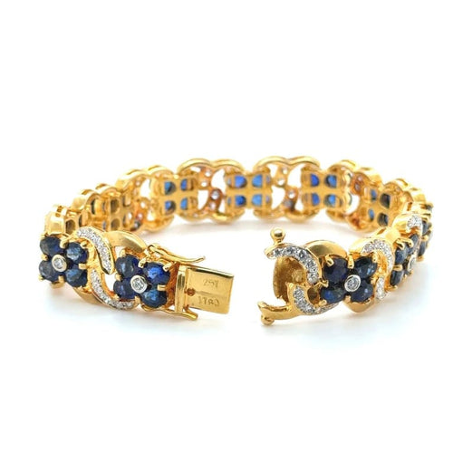 Bracelet Bracelet en or jaune 22 carats serti de saphirs et diamants 58 Facettes 1.0002546/1