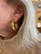 https://cdn.shopify.com/s/files/1/0647/1470/3075/files/Boucles_d_Oreilles_Vintage_-_Creoles_Torsadees_Or_Jaune_-_Joaillerie_Paris_-_Les_Pierres_de_Julie_3.jpg?v=1771864629