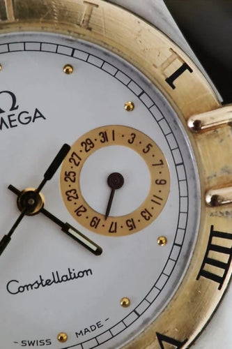 Montre Omega Constellation Day-Date - Montre en or jaune 18 ct et acier 58 Facettes