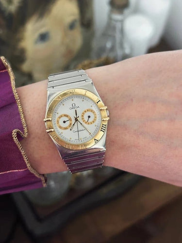 Montre Omega Constellation Day-Date - Montre en or jaune 18 ct et acier 58 Facettes