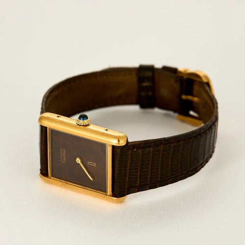 Montre Cartier Tank Must - Montre en argent plaqué or, cadran laqué marron « Bois » 58 Facettes