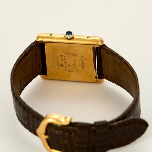 Montre Cartier Tank Must - Montre en argent plaqué or, cadran laqué marron « Bois » 58 Facettes